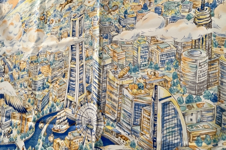 Una bufanda con un diseño estilo boceto que representa el paisaje urbano de Minato Mirai desde una perspectiva aérea.